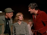 Stevens, Mulcahy and Hawkeye discuss the unknown soldier who refuses to let go of his cat in "Springtime".