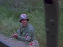 Medic-thats show biz.jpg (36 KB) This medic is not credited but he has a few lines as he tends to Marina after the mortar attack.