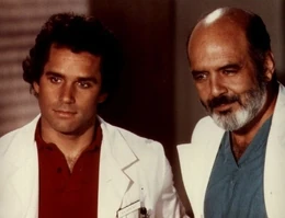 Pernell Roberts (right) as an older Dr. John McIntyre, with Gregory Harrison (left) as Dr. George "Gonzo" Gates from Trapper John, M.D..