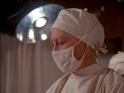 Here is another view of the same nurse, from the side. A close-up is not given to anyone else in this scene.