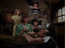 Shot of the B.J inside the nurses' tent. Shari is on the top bunk and Kellye below. Whitfield is the one in the green robe. The nurse in the yellow pajamas is not credited and we don't know who plays her.