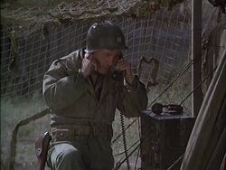 Tom Tarpey as the battalion surgeon at the aid station. Here he is calling in a chopper for Tyler because he can't survive an evacuation by ambulance.