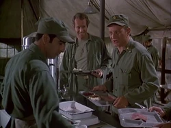 This is probably Carmine serving lunch to Burns. Note his distinctive sideburns. This is his first credit, in Season 5 Hawkeye Get Your Gun.