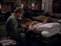 Radar and Owens-smilin jack.jpg (37 KB) Radar hands Owens his lucky four leaf clover in order to reassure him.