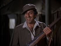 Klinger's first appearance in the entire series. A WAC uniform and a Garand rifle. See description in The Klinger Collection.