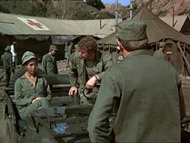Frank trying to stop Trapper taking the jeep on a date with a nurse. Wonder who she is? Another of our unidentified extras.