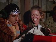 Jo Ann's first credited appearance as "nurse", shown here admiring the dress Klinger has received as a Christmas present. The scene is from Season 7 "Dear Sis".