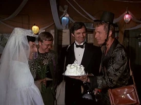 Hawkeye and Trapper get dressed up for Klinger's wedding.