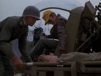 Jack and Owens-smilin jack.jpg (32 KB) Owens being loaded onto Jack's chopper. This episode shows a lot of detail about how the wounded are loaded and secured onto a Sioux helicopter.