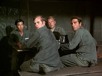 A group of extras in the mess tent about to clear out when they see Henry who seems to be attracting accidents. Ralph Grosh is second from right, seated facing the camera.