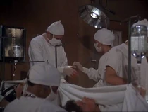 Laurie Bates has appeared uncredited several times already. Here is her first credited and speaking part. She is passing Winchester a hemostat and advising him they are running short.