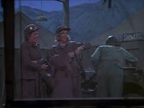 Nurses Carlye and Becky arrive at the 4077th, as observed through the mosquito net of the Swamp. They are wearing the taupe service uniform.
