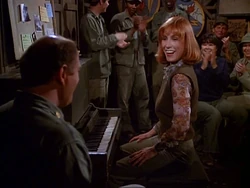 Ellie-o club-thats show biz.jpg (38 KB) Ellie at the piano. Winchester says her skill at the piano keyboard has "squeezed" the air out of him.