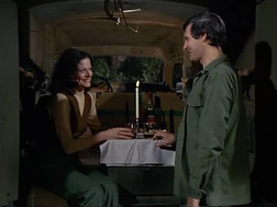 Hawkeye's date with Lieutenant Regina Hoffman, showing a rare interior shot of the ambulance. The racks and litters can be seen on the side walls, but what is that contraption projecting from the roof?