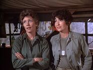 Campbell with Baker-patent 4077.jpg (66 KB) Baker (left) with Lieutenant Campbell in Season 6 "Patent 4077". Her wedding ring can just be seen on her left hand.
