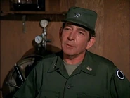 Colonel Bidwell, Operations Officer of I Corps from "The General's Practitioner". The I Corps insignia is visible on his left sleeve. The insignia on his left lapel specifies that he is an aide to a three-star general.