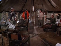 Charles introduces Hawkeye and B.J. to Kwang. Note there are two phonographs in the Swamp! One is next to Charles' bunk, while the other is in the foreground.
