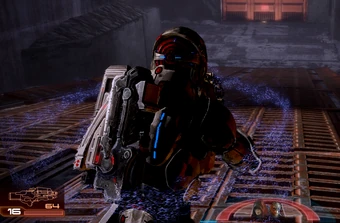 The moment Shepard's shields go down: note the shield "particle" flickers surrounding Shepard, as well as the depleted shield-indicator (light blue semicircle) on the HUD.