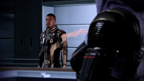 Jacob and Tali talk in the debriefing room