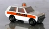 Police Patrol in white, with orange stripe sticker with large lettering. Josiah Carberry Collection.