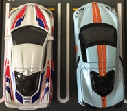 A top view of the Matchbox Super Chase white (left) and Greenlight Gulf Edition (right, 1/64).