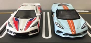A front view of the Matchbox Super Chase white (left) and Greenlight Gulf Edition (right, 1/64).