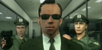 Two policemen assisting Agent Smith