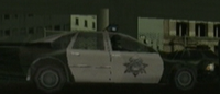 A police car with SWAT members in it.