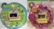 The yellow cottage's final packaging, compared to the prototype packaging shown at Toy Fair New York in 2005.