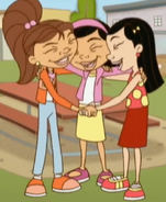 Maya, Chrissy and Maggie hugging, holding hands, and laughing