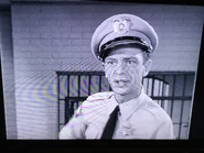 Barney describing how to use an intercom to communicate with the prisoners