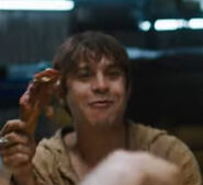 Tim eating chicken.