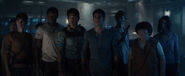 Tim and the other Gladers looking at the escape door.