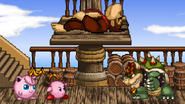 Kirby and Jigglypuff battling Bowser while Donkey Kong is knocked down.