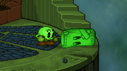 A green Sandbag lying on the ground next to green PAC-MAN, on Tower of Salvation.