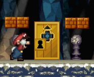 Mario approaching a locked door in the underground area.