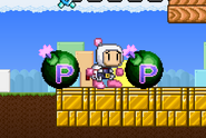 Bomberman about to use Jetpack while two green bombs are about to explode.