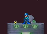 Mega Man standing next to the Energy Capsule, on Castle Wily.