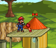 Mario in front of a Firework on Saturn Valley.