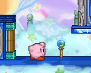 Kirby next to the Beam Rod.