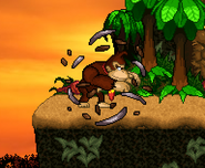 Donkey Kong pops out from a DK Barrel for his on-screen appearance on Jungle Hijinx.
