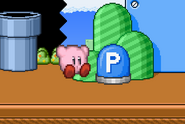 Kirby falling next to a P-Switch.