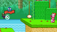 Luigi using his neutral aerial to attack one of Birdo's eggs.