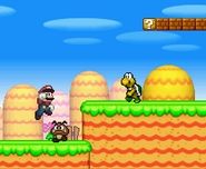 A Koopa walking near a Goomba, while Mario jumps.