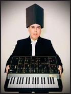 Ego Plum holding The Residents' APR Odyssey, 2020.