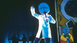 Photo from a live performance of the track, with dancer  portraying the , 1982