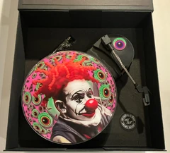 The contents of the "Duck Sauce Refried" object d'art package; the record player and attached dubplate are visible, as well as the USB connection cable