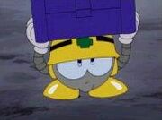 A Metall EX holding an Item Box in Super Adventure Rockman.