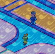 Mr. Prog being swept around by WindMan.EXE's tornado gusts in Mega Man Battle Network 4.