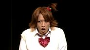 Yosuke in the cross-dressing pageant in Persona 4 Visualive the Evolution